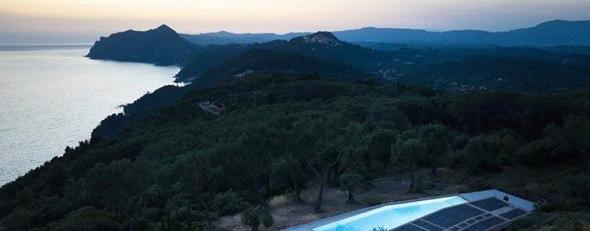 Aerial twilight view of villa and sea