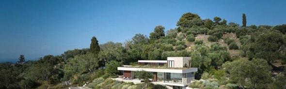 Aerial daytime view of villa on the hillside
