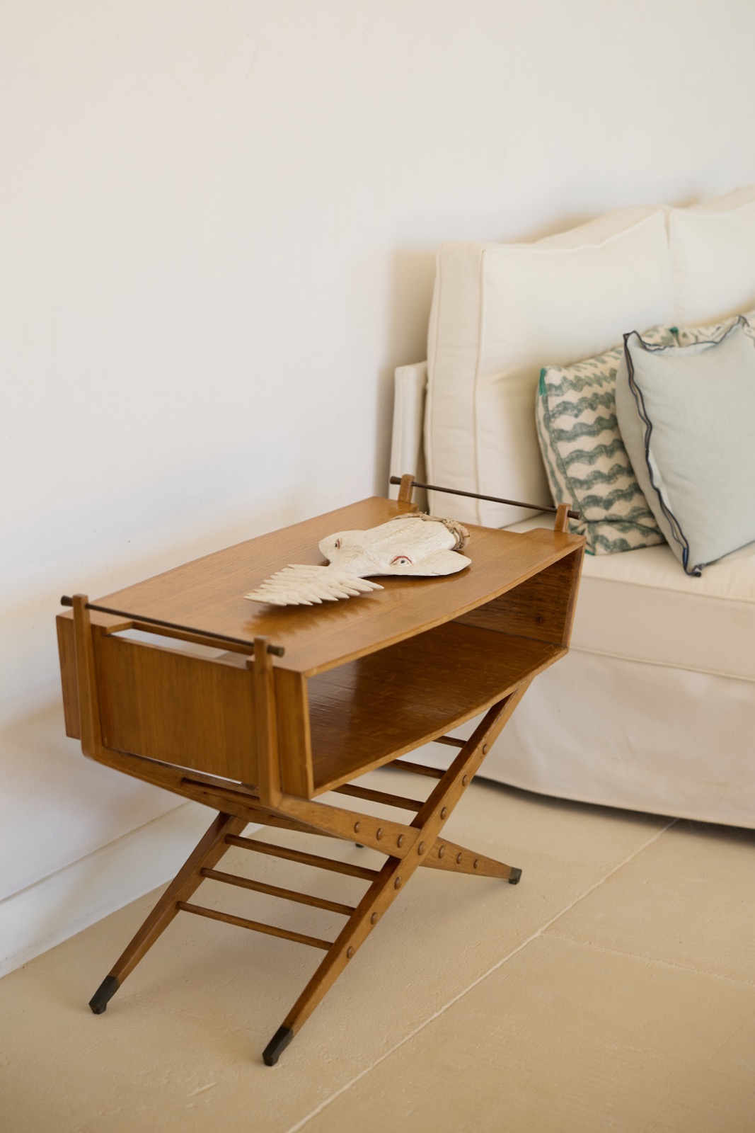 Interior view onto terrace with sculptural chair